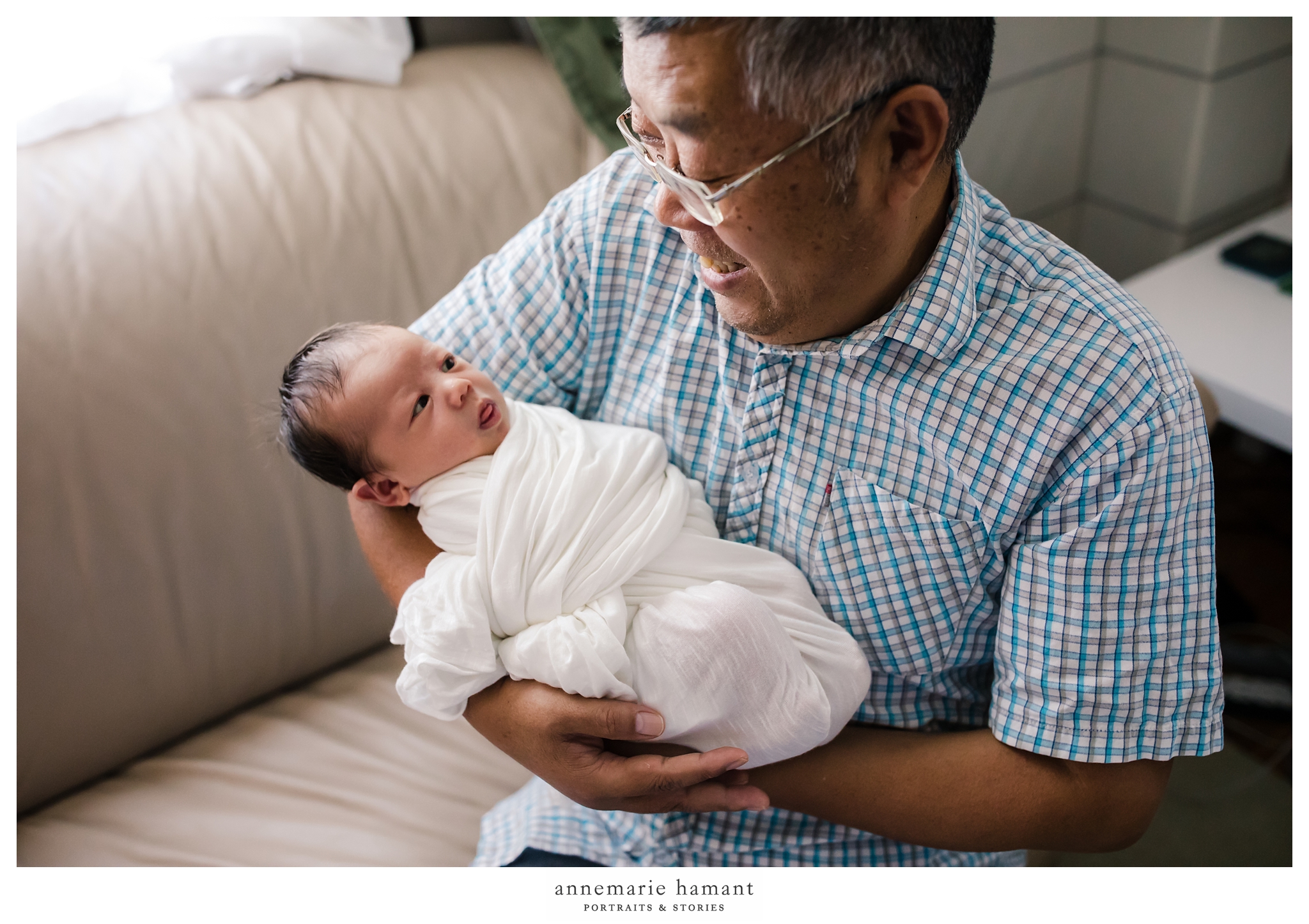  grandpa holding newborn baby 