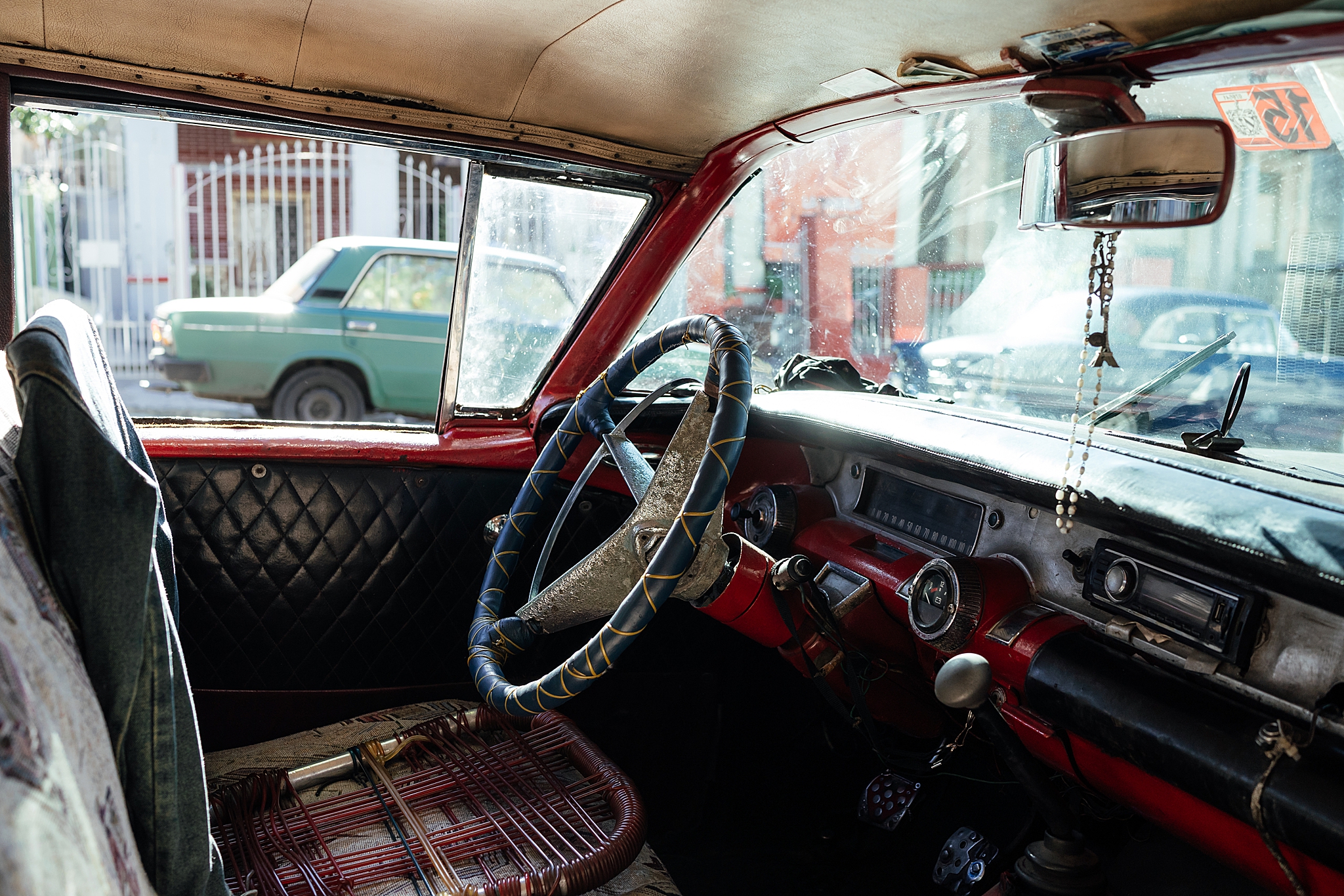  I loved looking into the old cars in Cuba to see how the maintain them. Here a dilapidated lawn-chair is an upgrade to the decaying upholstery.  