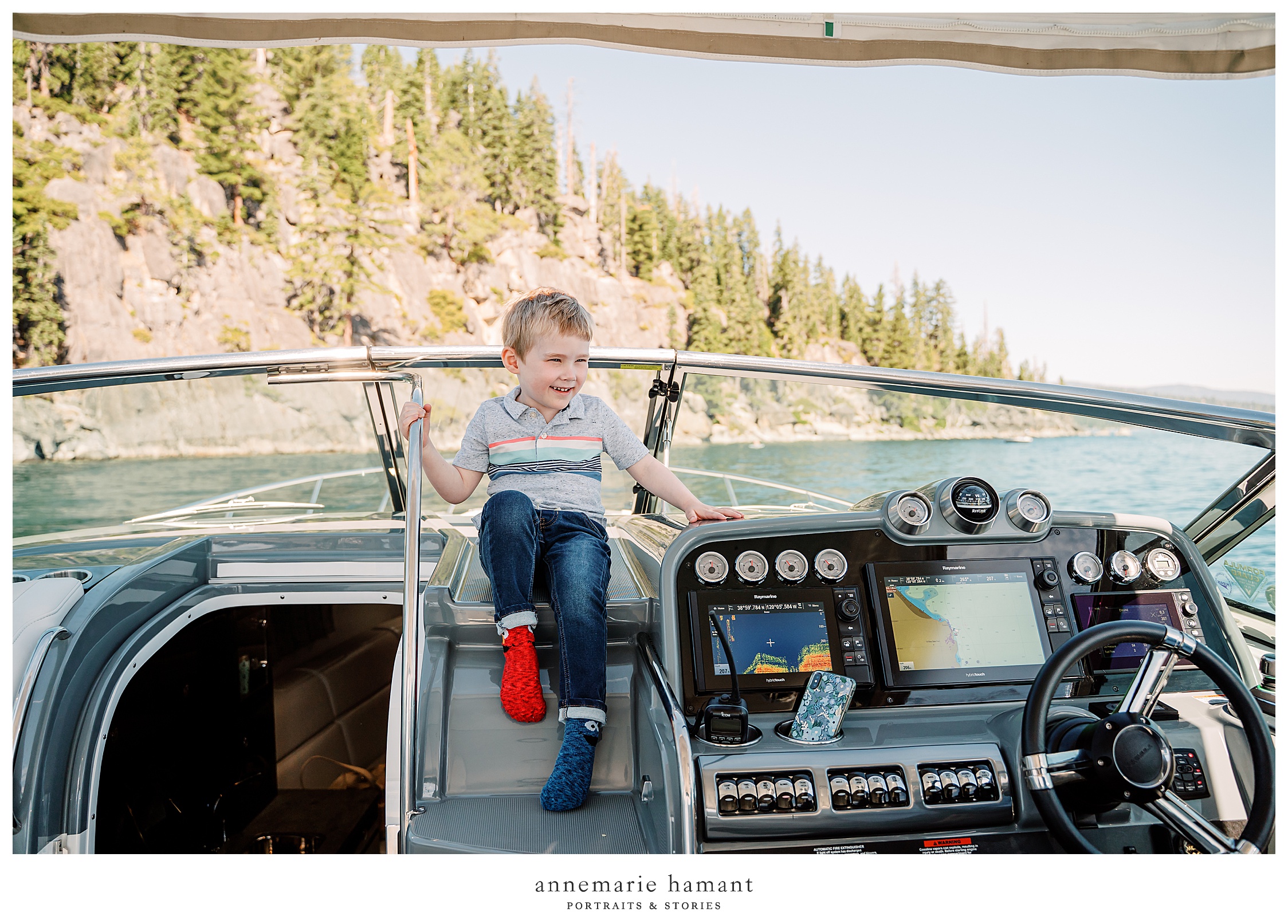  boy plays on boat on Lake Tahoe.  