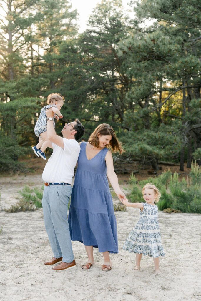 Lewes DE Photographer captures families at play in the wooded natural areas of the beachside park. 