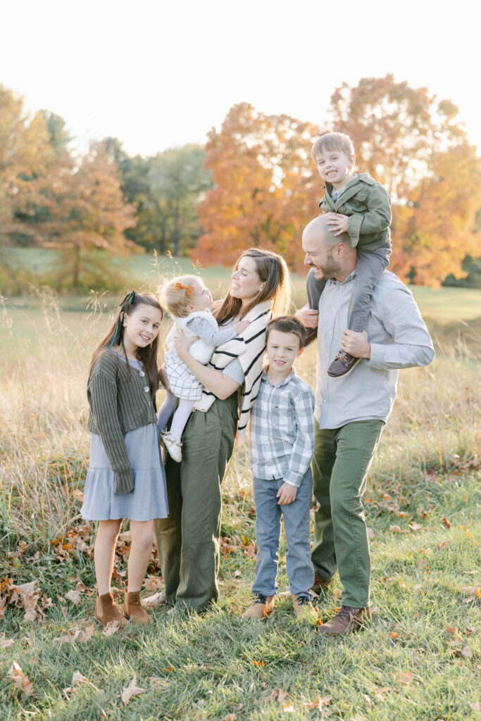 family of 6 in a field for a family session before eating at Hockessin DE Restaurants