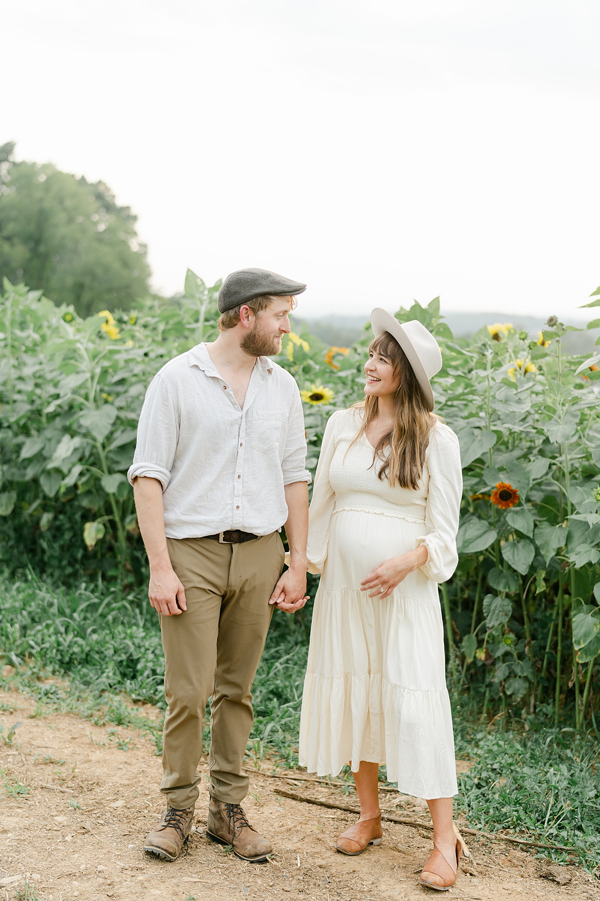 expecting husband and wife in sunflowers by Philadelphia Maternity Photographer, AnneMarie Hamant