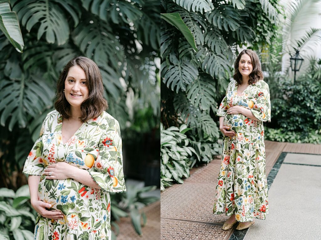 a maternity session for an expecting mother standing in a conservatory while holding her baby bump at Longwood Gardens