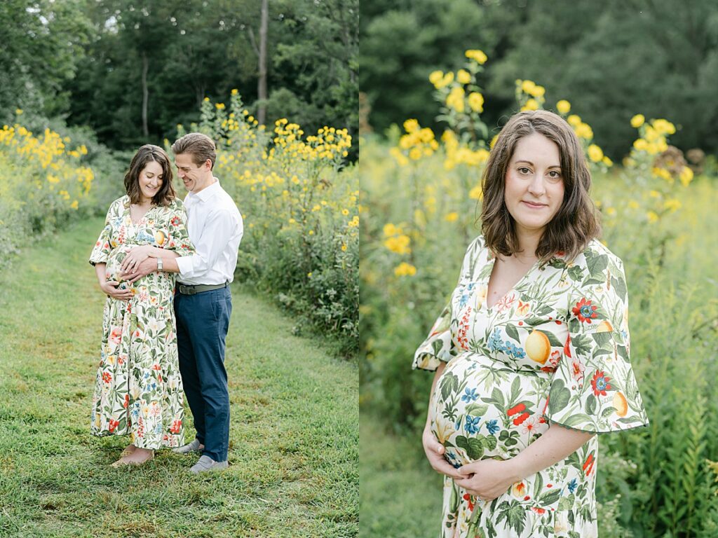 pregnant mom and dad snuggling together in a wildflower field