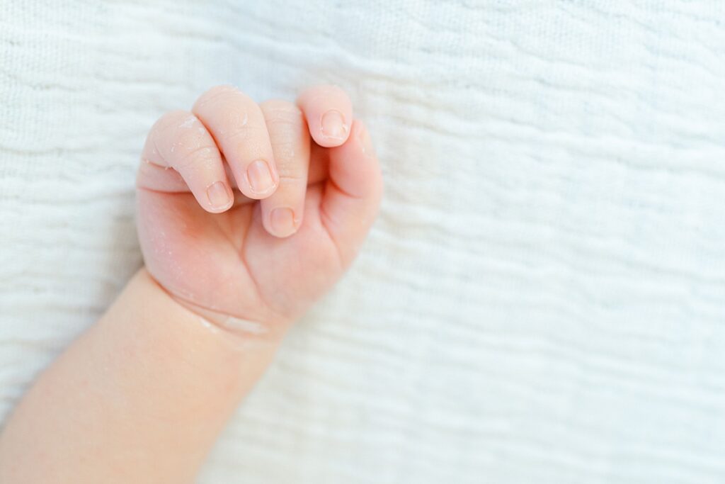 close up of newborn boys hands