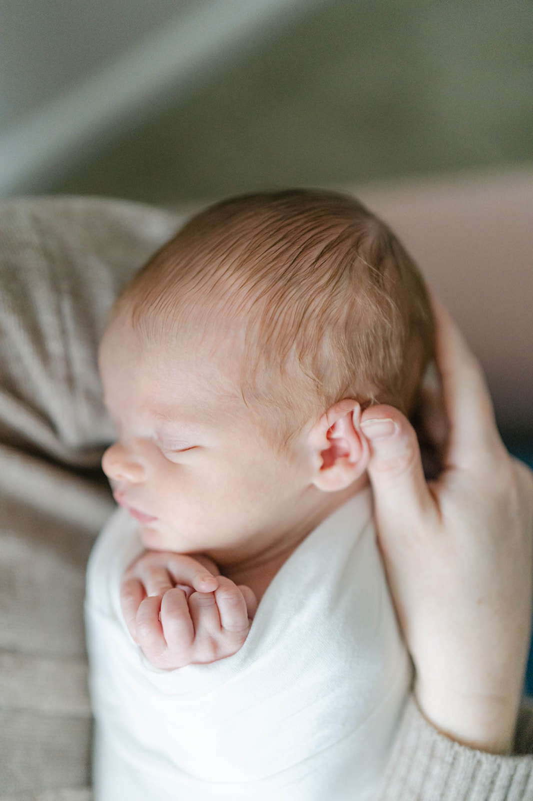 newborn baby sleeps in mom's arms Philadelphia midwives