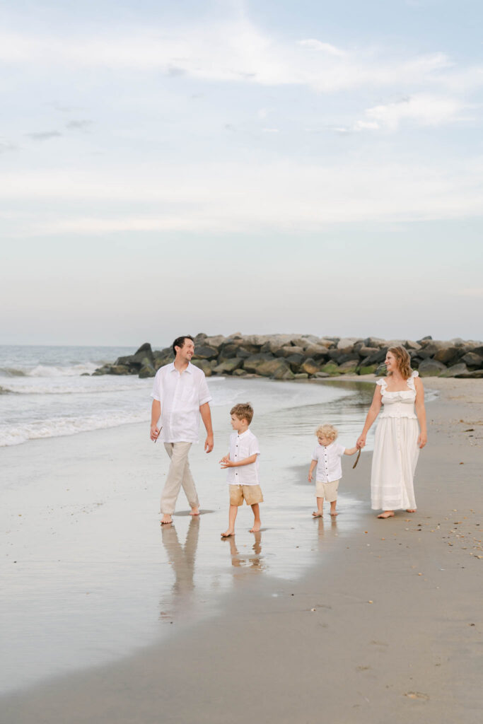 Family walks in the water during a Bethany Beach Photo Session