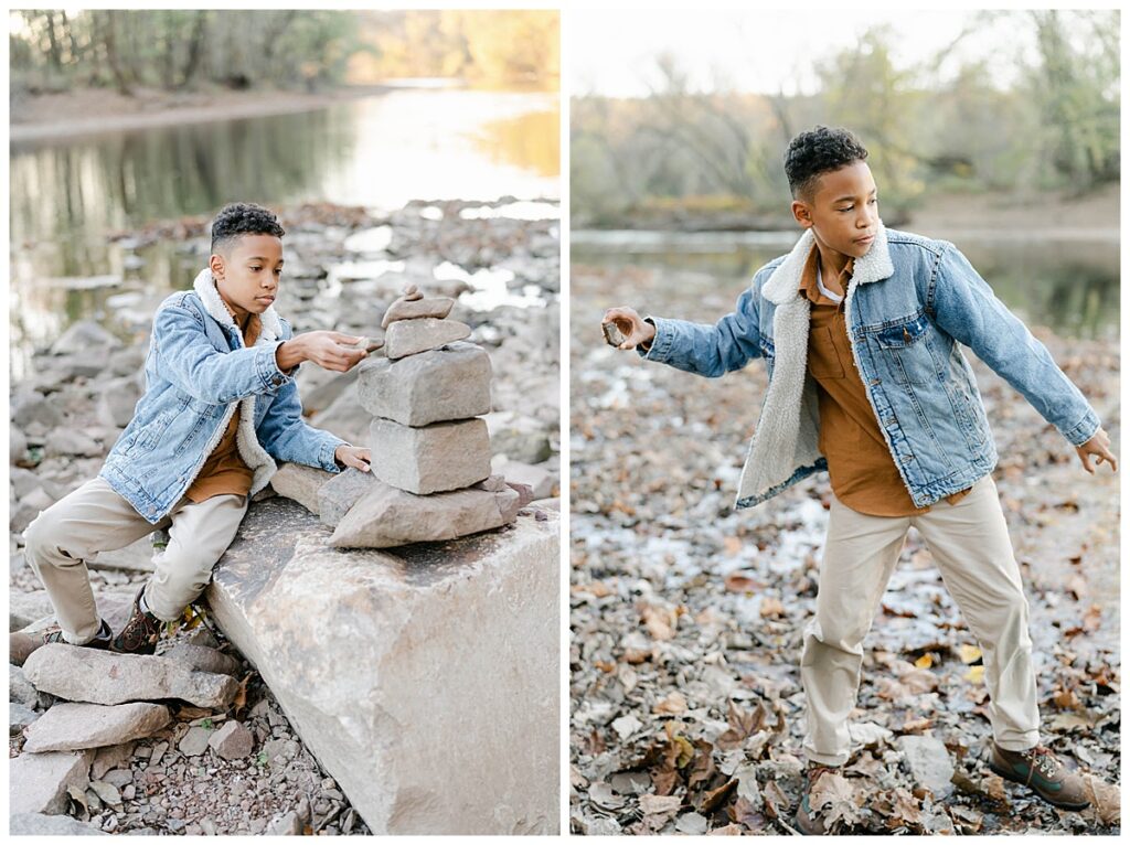 A teenage boy stacks river rocks in Valley Forge National Park