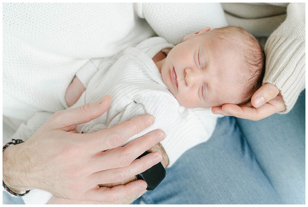 Newborn baby in parent's hands