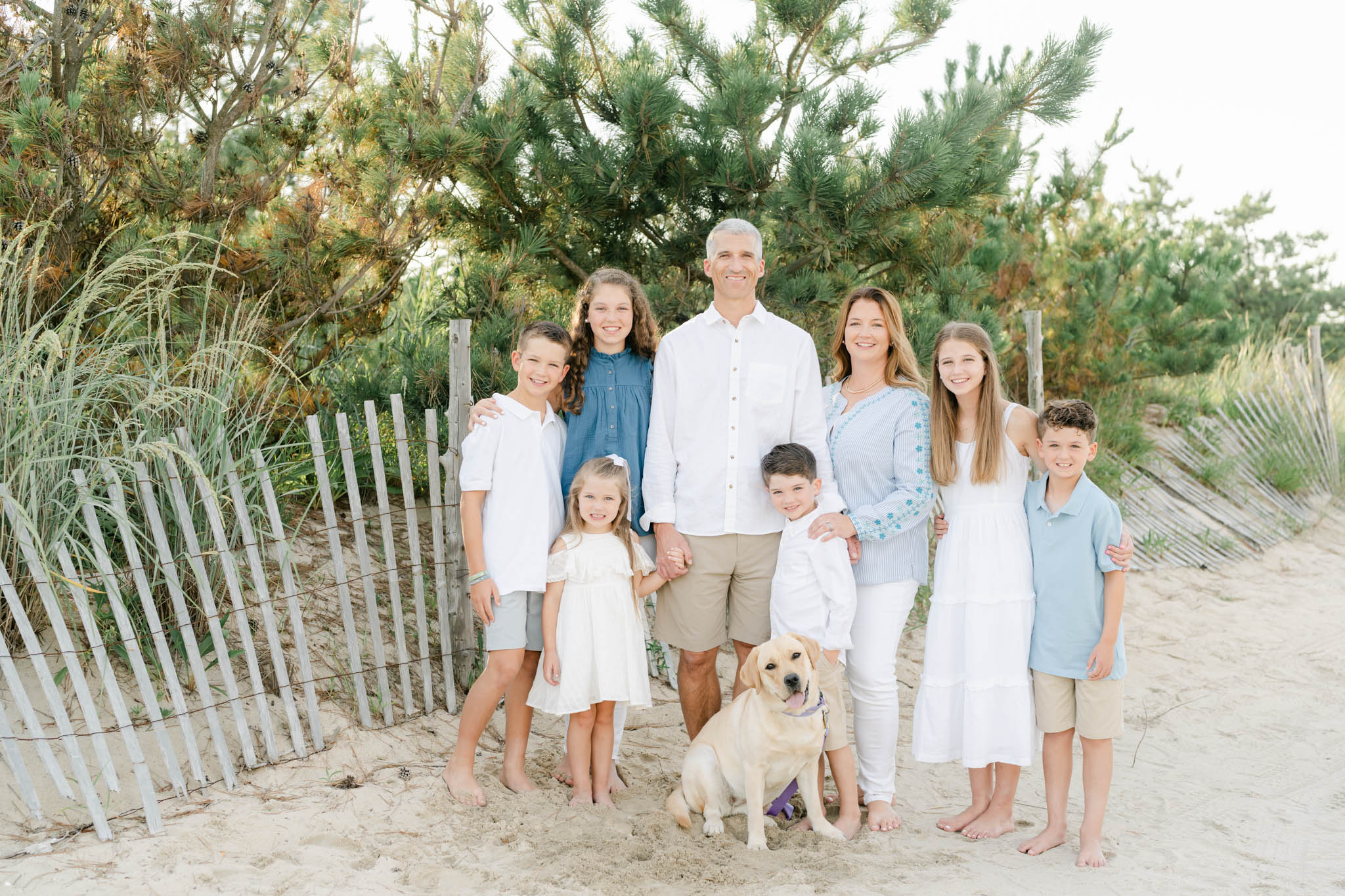 Family Poses for a picture on the beach in Rehoboth Beach DE